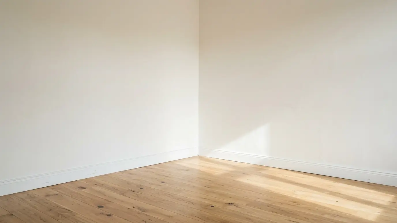 Before: a living room corner with an empty corner with a bare wall